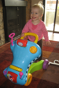 Adria standing with her walker