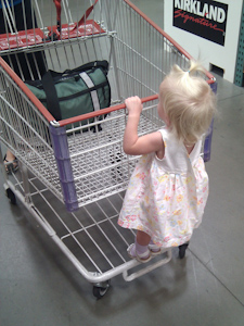 Adria riding the Costco shopping cart