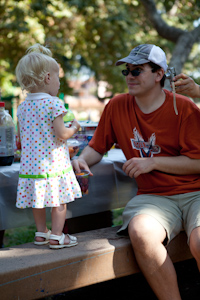 Adria eating fruit with "Uncle Paul"