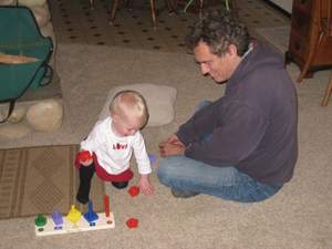 A rare sighting of Grumpa smiling at the adorable baby A rare sighting of Grumpa smiling at the adorable baby