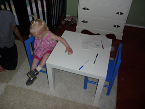 Adria playing with her new table and chairs