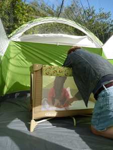Ivan, Adria, and the crib set up inside the tent