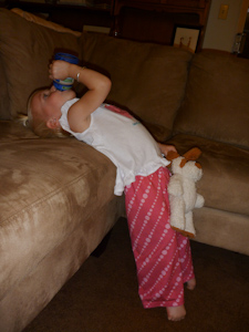 Adria leaning back to drink her sippy cup Adria leaning back to drink her sippy cup
