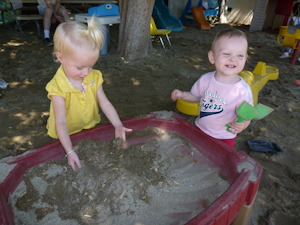 Adria and Helen playing at the sand table Adria and Helen playing at the sand table