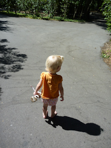 Adria standing on the hot pavement, carrying her shoes Adria standing on the hot pavement, carrying her shoes