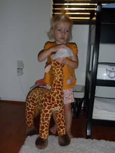 Adria wiping her giraffe's nose with a baby wipe Adria wiping her giraffe's nose with a baby wipe