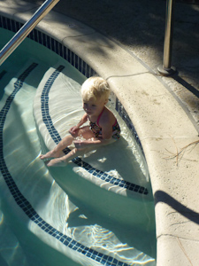 Adria sitting on the pool steps Adria sitting on the pool steps