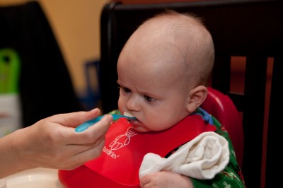 Austin looking cross-eyed at the food going into his mouth