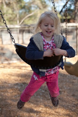 Running the swings up to their peak and jumping!