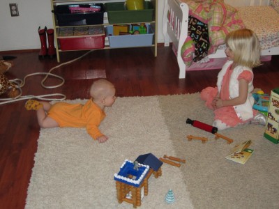 Pushing up to see what his big sister is up to