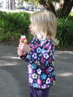 Adria blowing bubbles on Easter morning